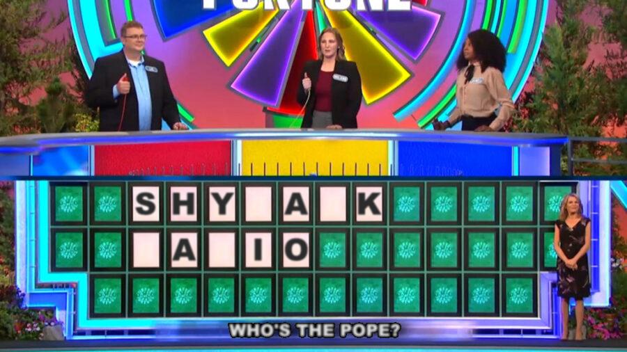Screen shot from TV quiz show Wheel of Fortune. The board is showing SHY-A-K -A-IO.